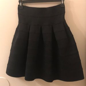 Black high waisted skirt.
